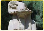 Ancient Egyptian statue of a ram with detailed features, representing a significant cultural symbol.