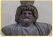Bust of a historical figure with a beard and crown, carved from stone, showcasing intricate details.