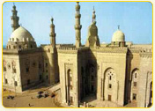 Historic mosque complex with domes and minarets in Cairo, Egypt, showcasing traditional Islamic architecture.
